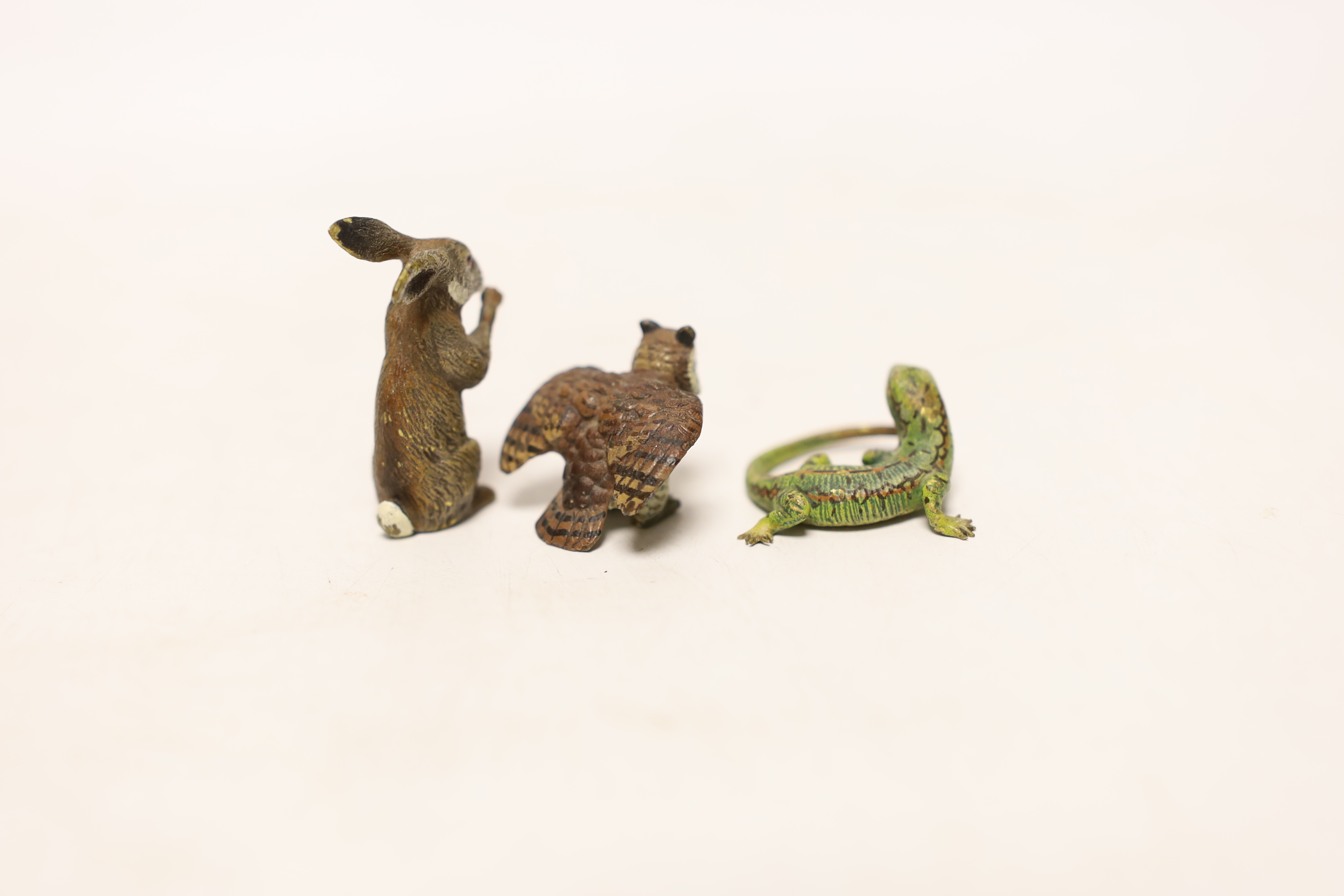 Three Austrian cold painted bronze models of a hare, a lizard and an owl, largest 3.5cm high
